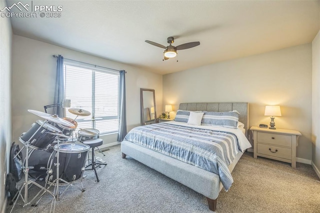 bedroom featuring carpet, baseboards, and ceiling fan