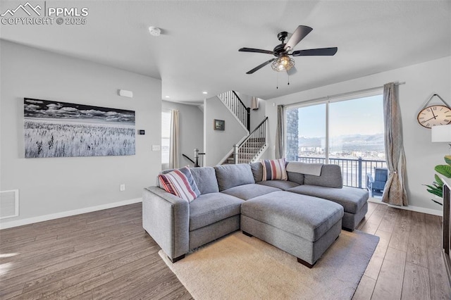 living area featuring wood finished floors, plenty of natural light, ceiling fan, and recessed lighting