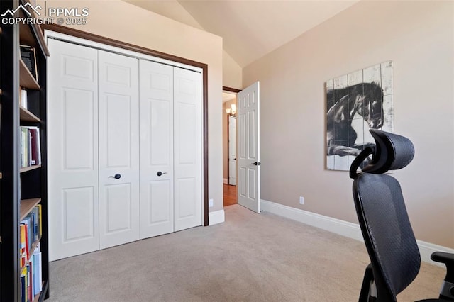 home office with carpet floors, baseboards, and lofted ceiling