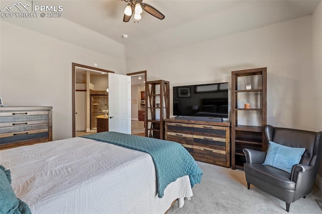 bedroom with carpet flooring, ceiling fan, and ensuite bath