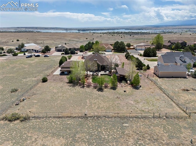 bird's eye view featuring a water view and a residential view