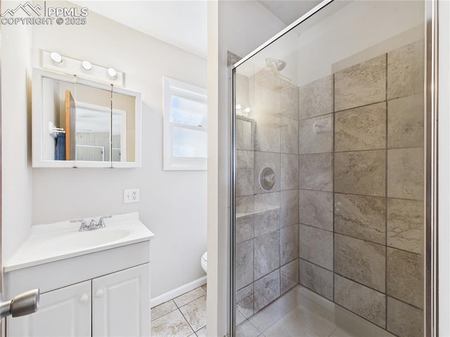 full bath featuring vanity, toilet, tile patterned flooring, and a stall shower