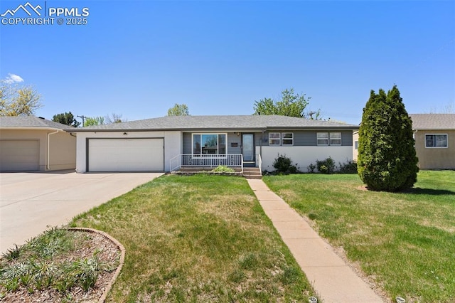 view of front of house with a garage, covered porch, driveway, and a front yard