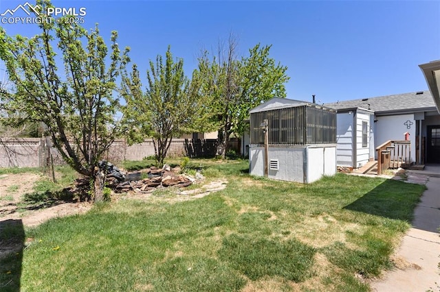 view of yard with a fenced backyard