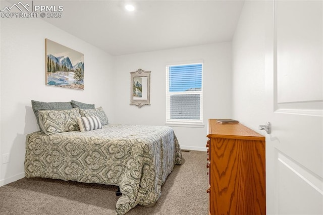 bedroom featuring carpet floors and baseboards