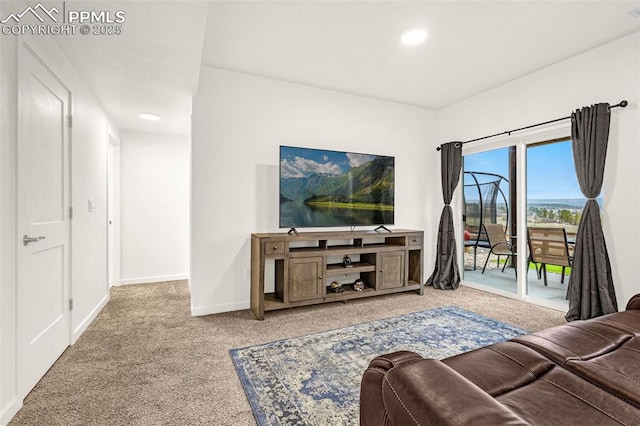 carpeted living room with baseboards, recessed lighting, and visible vents