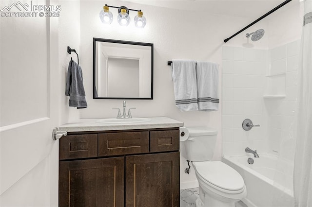 full bathroom featuring washtub / shower combination, vanity, toilet, marble finish floor, and baseboards