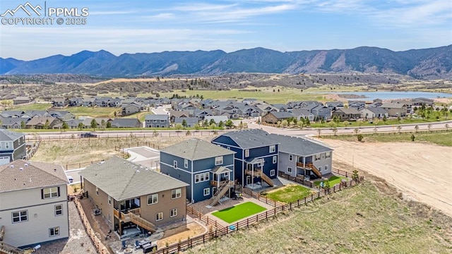 drone / aerial view with a residential view and a mountain view