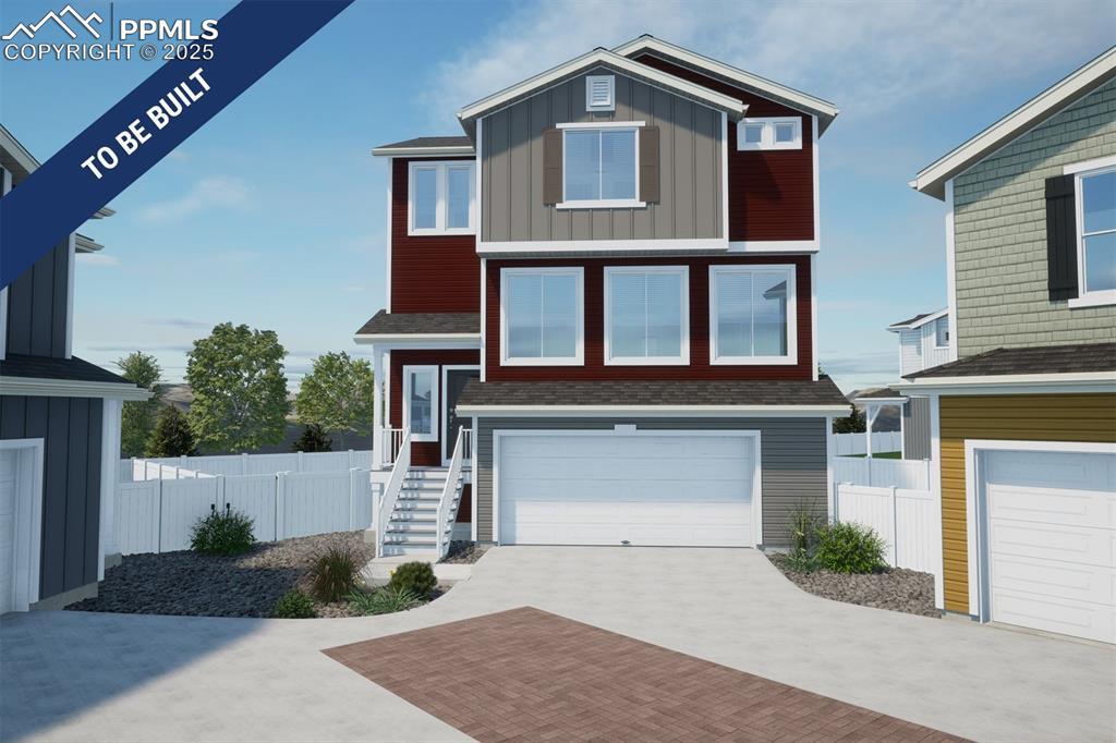 5640 Dakan Loop, Colorado Springs, CO 80927 - view of front of property featuring board and batten siding, decorative driveway, and an attached garage