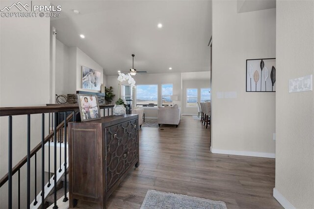 16990 Early Light Dr, Colorado Springs, CO 80908 - hallway with recessed lighting, baseboards, wood finished floors, and high vaulted ceiling