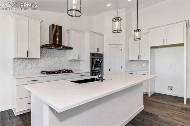 16990 Early Light Dr, Colorado Springs, CO 80908 - kitchen with wall chimney range hood, white cabinets, and gas stovetop
