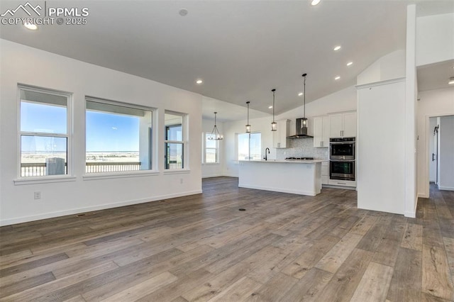 16990 Early Light Dr, Colorado Springs, CO 80908 - interior space featuring a sink, baseboards, recessed lighting, and dark wood-type flooring