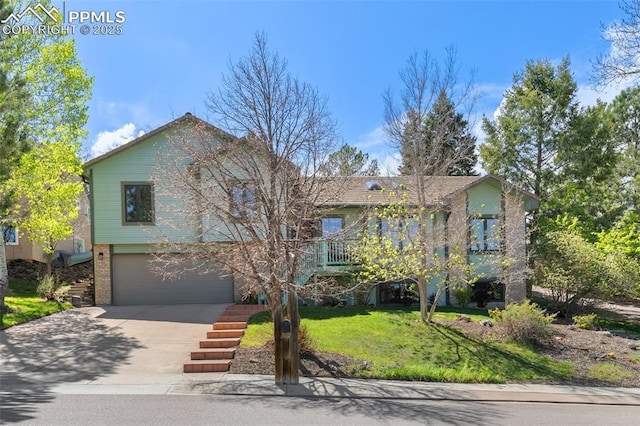 view of front of property featuring concrete driveway, brick siding, an attached garage, and a front yard