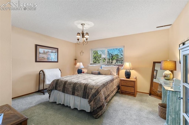 bedroom with carpet floors, baseboards, a textured ceiling, and a chandelier
