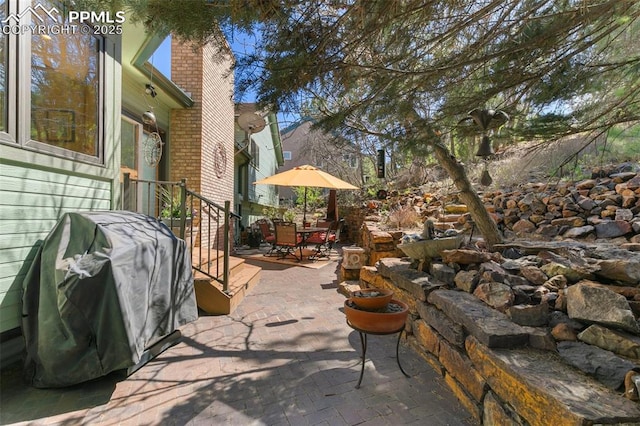 view of patio featuring grilling area and outdoor dining area