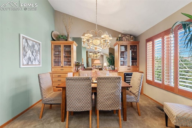 dining room with baseboards, vaulted ceiling, a notable chandelier, and light carpet