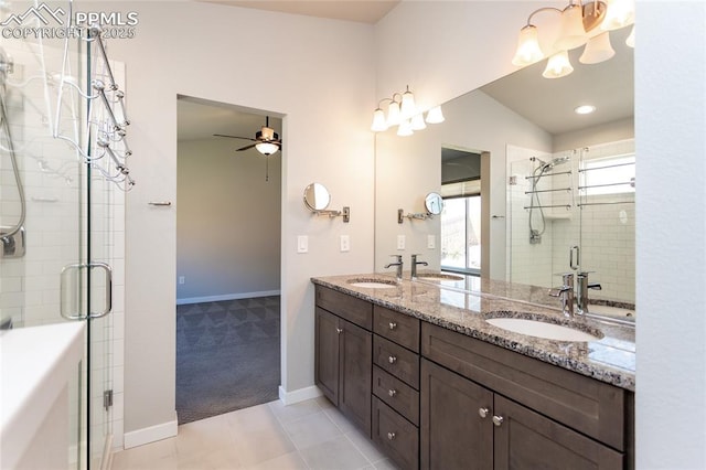 full bath with double vanity, a sink, and a stall shower