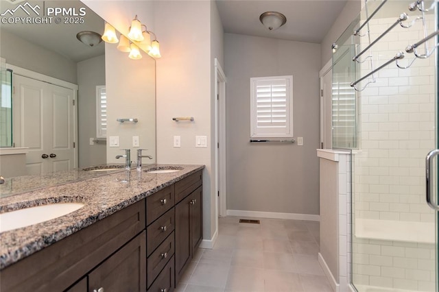 bathroom featuring a sink and a stall shower
