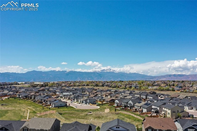 bird's eye view with a residential view and a mountain view