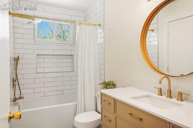 bathroom with vanity, shower / bath combo with shower curtain, and toilet