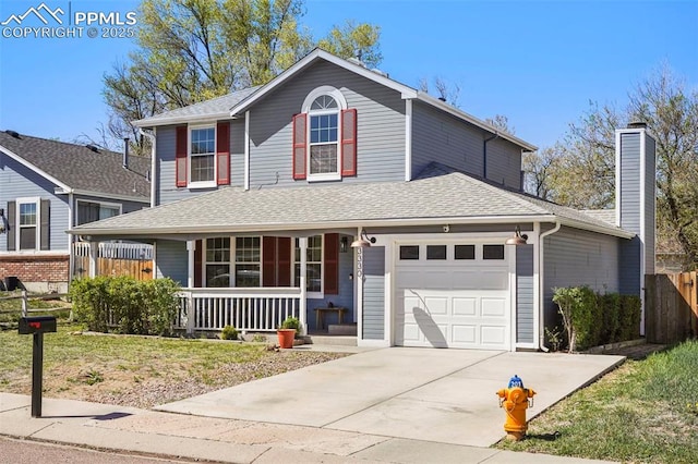 traditional-style home with fence, roof with shingles, a garage, a porch, and concrete driveway