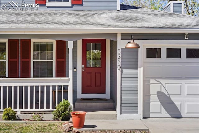 entrance to property featuring a garage, covered porch, a shingled roof, and a chimney