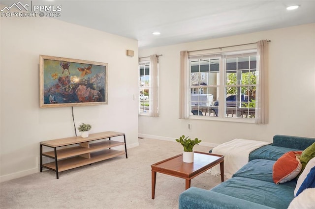 living area featuring baseboards, carpet flooring, and recessed lighting