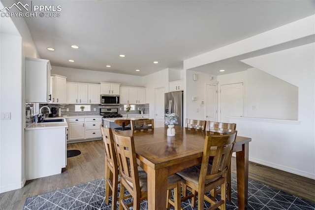 dining area with recessed lighting, baseboards, and dark wood-style floors