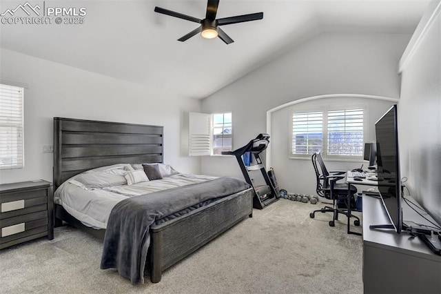 carpeted bedroom with a ceiling fan and lofted ceiling