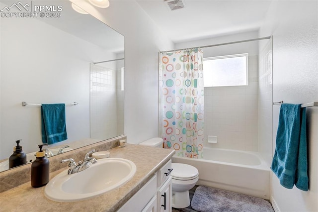 bathroom featuring vanity, shower / bath combo, toilet, and visible vents