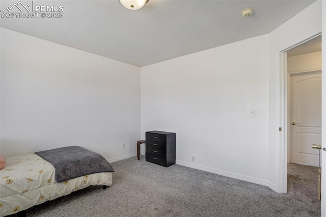 carpeted bedroom with baseboards