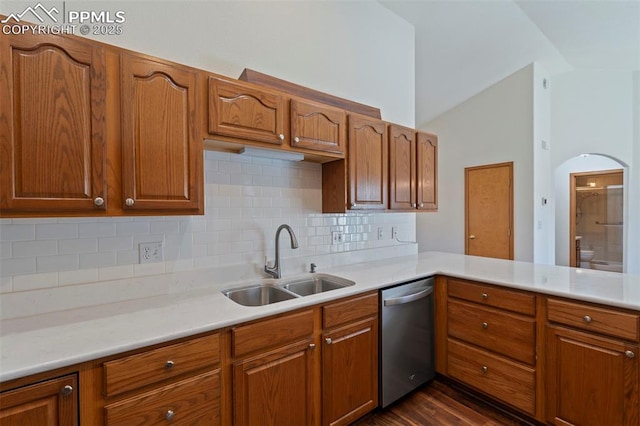 6151 Pine Hill Dr, Colorado Springs, CO 80918 - kitchen featuring lofted ceiling, light countertops, tasteful backsplash, a sink, and dishwasher