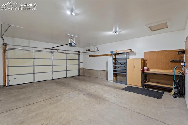 6151 Pine Hill Dr, Colorado Springs, CO 80918 - garage with a garage door opener and a workshop area