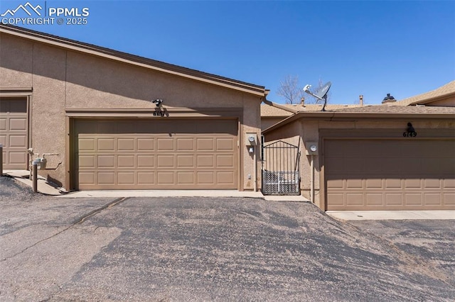 6151 Pine Hill Dr, Colorado Springs, CO 80918 - garage with a gate