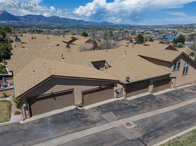 6151 Pine Hill Dr, Colorado Springs, CO 80918 - drone / aerial view with a mountain view