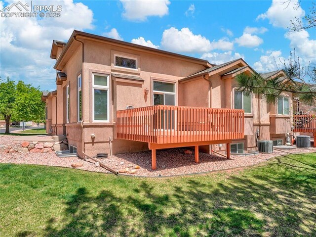 2174 Alpine Shadows Vw, Colorado Springs, CO 80919 - back of property with central AC unit, stucco siding, a wooden deck, and a yard