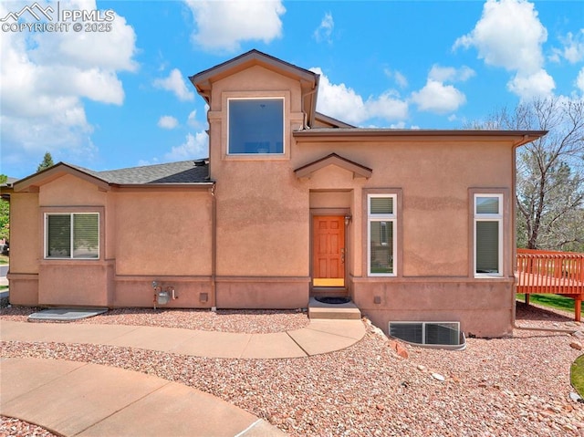 2174 Alpine Shadows Vw, Colorado Springs, CO 80919 - view of front of house featuring a deck and stucco siding