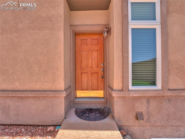 2174 Alpine Shadows Vw, Colorado Springs, CO 80919 - view of exterior entry featuring stucco siding