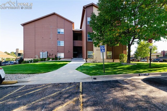 6735 Delmonico Dr Unit 202, Colorado Springs, CO 80919 - view of building exterior with uncovered parking