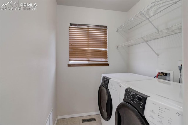 7884 Gladwater Rd, Peyton, CO 80831 - clothes washing area featuring baseboards, visible vents, laundry area, and washing machine and clothes dryer