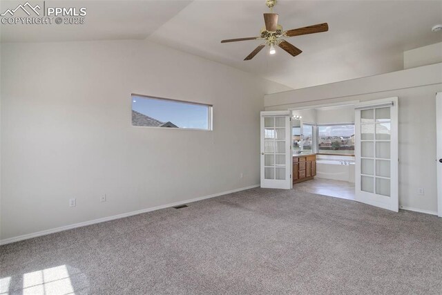 7884 Gladwater Rd, Peyton, CO 80831 - spare room with light colored carpet, visible vents, french doors, a ceiling fan, and vaulted ceiling