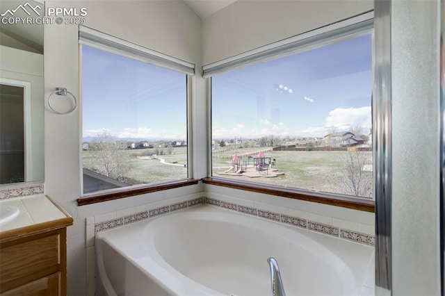 7884 Gladwater Rd, Peyton, CO 80831 - bathroom featuring a garden tub and vanity