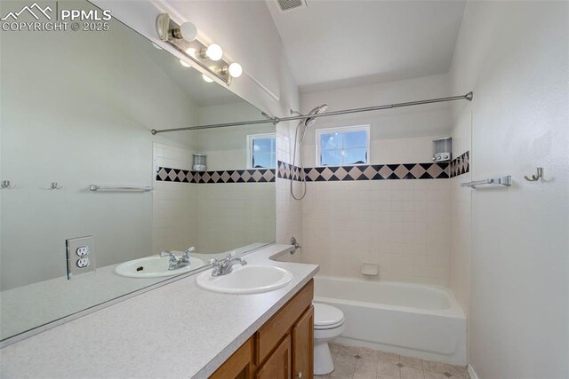 7884 Gladwater Rd, Peyton, CO 80831 - full bath with visible vents, vanity, toilet, lofted ceiling, and bathing tub / shower combination