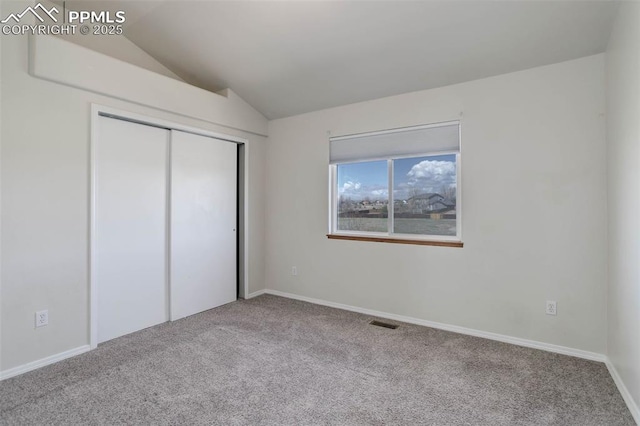 7884 Gladwater Rd, Peyton, CO 80831 - unfurnished bedroom featuring visible vents, lofted ceiling, carpet, and a closet