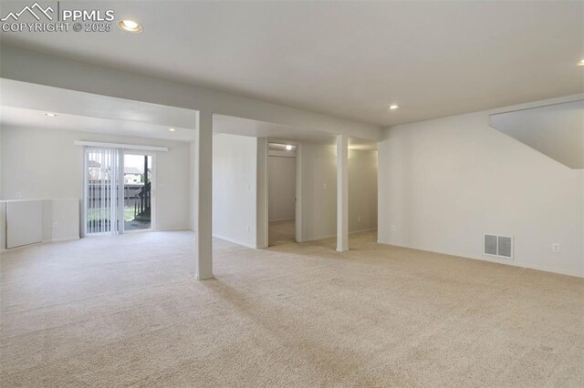 7884 Gladwater Rd, Peyton, CO 80831 - below grade area with light colored carpet, visible vents, and recessed lighting