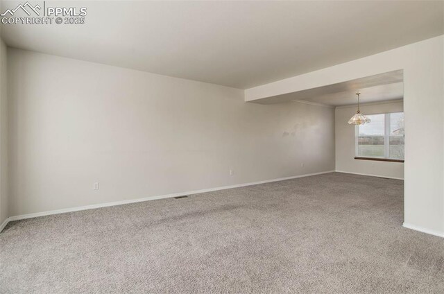 7884 Gladwater Rd, Peyton, CO 80831 - spare room featuring baseboards, carpet, and visible vents
