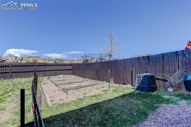 7884 Gladwater Rd, Peyton, CO 80831 - view of yard featuring a fenced backyard, central air condition unit, and a vegetable garden