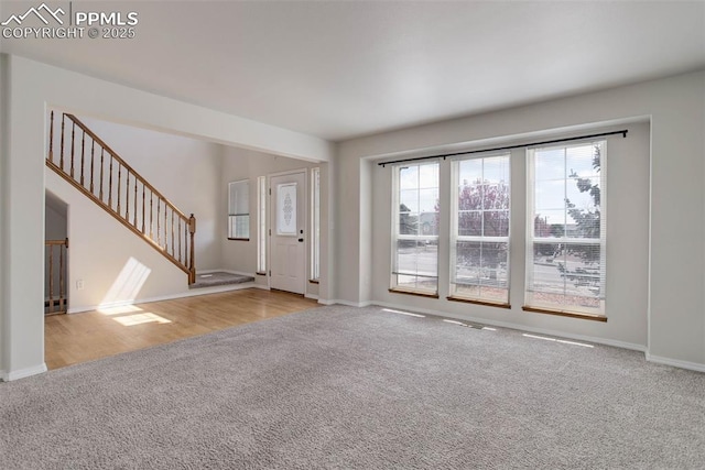 7884 Gladwater Rd, Peyton, CO 80831 - carpeted entrance foyer with baseboards and stairs