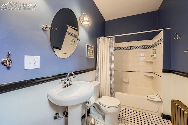 bathroom with toilet, radiator heating unit, and shower / bath combo