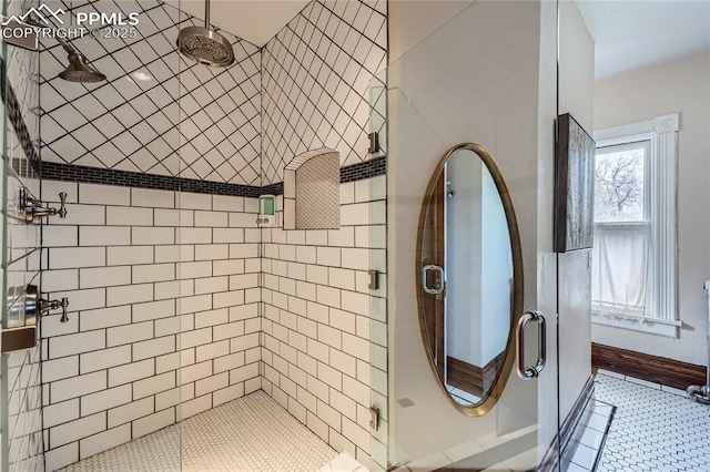 bathroom featuring tile patterned flooring and a stall shower